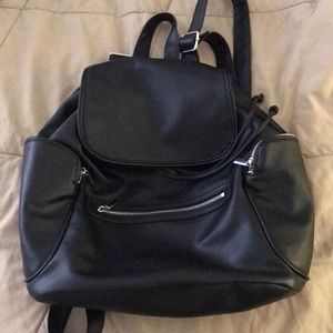 Women’s black pleather backpack.